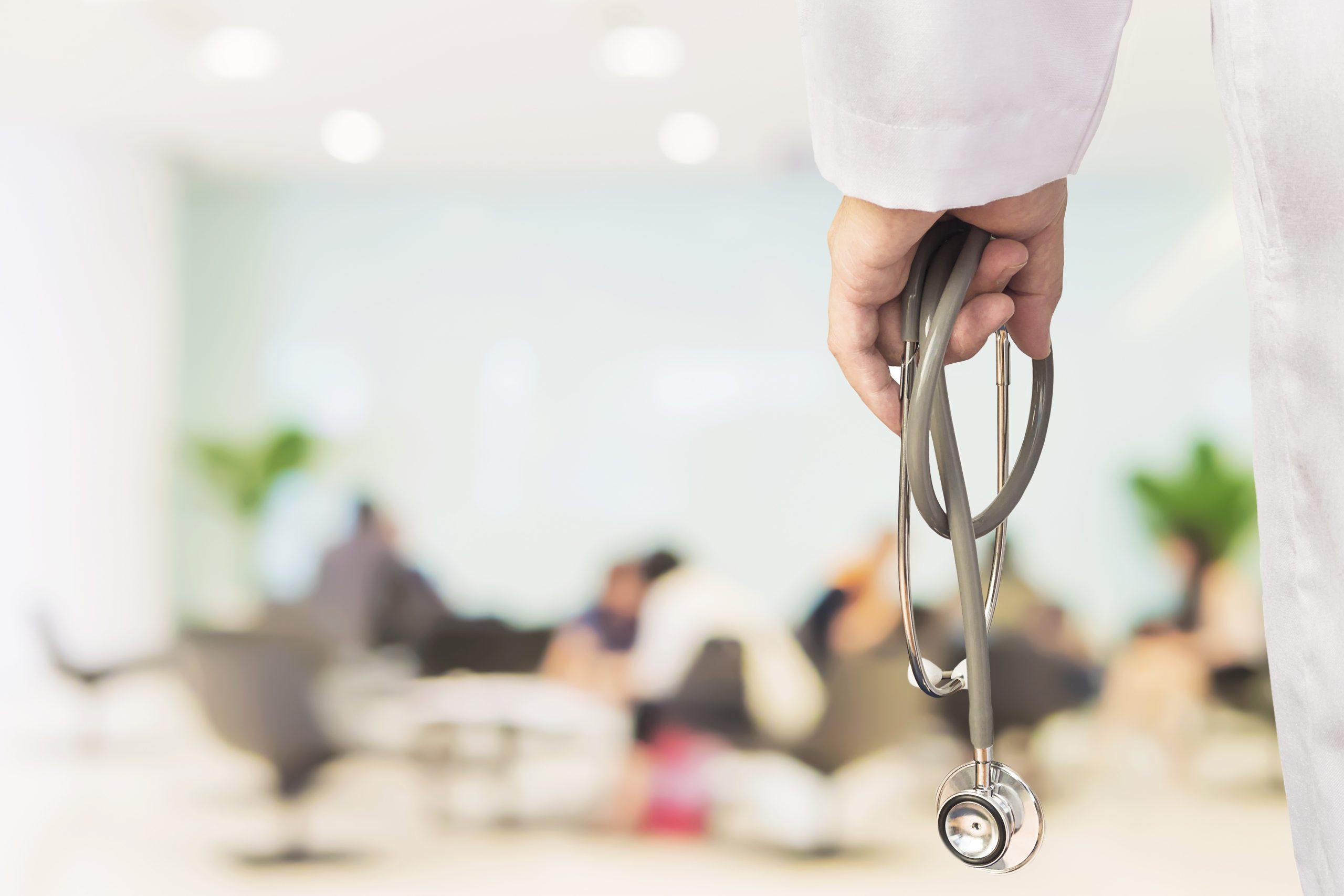 A doctor holding a stethoscope